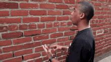 meme talking to wall|dude arguing with brick wall.